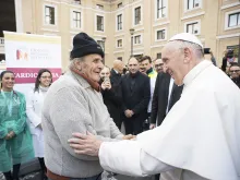 Pope Francis greets a participant in the World Day of the Poor in Rome, Nov. 16, 2017. 