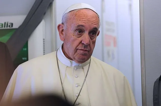 Pope Francis on the papal flight from Rome, Italy to Quito, Ecuador on July 5, 2015. ?w=200&h=150