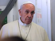 Pope Francis on the papal flight from Rome, Italy to Quito, Ecuador on July 5, 2015. 