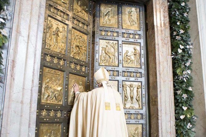 Pope Francis opens the Holy Doors at St Peters Basilica to begin the Jubilee Year of Mercy Dec 8 2015 Credit LOsservatore Romano CNA 12 8 15