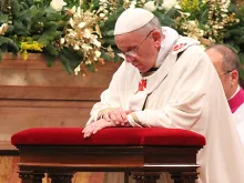 Pope Francis praying. 