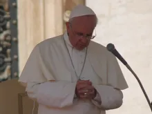 Pope Francis prays during his General Audience on Sept. 25, 2013 