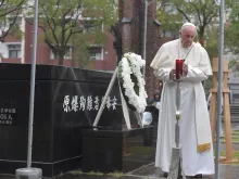 Pope Francis prays at the Nagasaki ground zero site on Nov. 24, 2019.