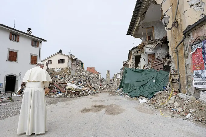 Pope Francis prays at the red zone in Amatrice during a private Oct. 4, 2016, visit to those affected by a massive earthquake in August. ?w=200&h=150