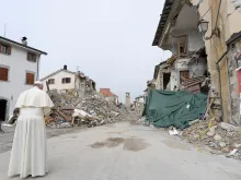 Pope Francis prays at the red zone in Amatrice during a private Oct. 4, 2016, visit to those affected by a massive earthquake in August. 