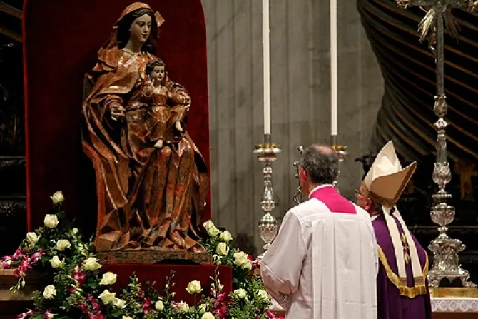 Pope Francis prays before a statue of Mary in St Peters Basilica on Nov 30 2013 Credit Lauren Cater CNA