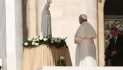 Pope Francis prays before Our Lady of Fatima May 13, 2015.