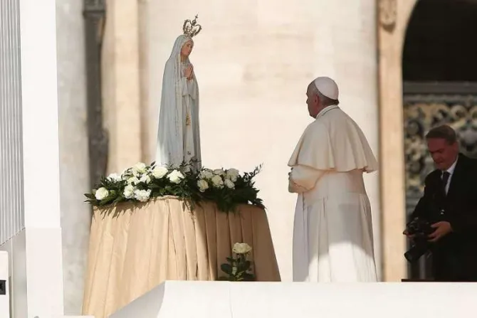 Pope Francis prays before a statue of Our Lady of Fatima May 13 2015 Credit Daniel Ibanez CNA