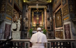 Pope Francis prays before the crucifix of the Church of San Marcello al Corso March 15, 2020.   Vatican Media.