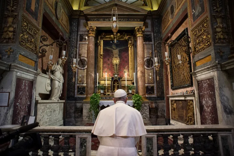 Pope Francis prays before the crucifix of the Church of San Marcello al Corso March 15, 2020. Credit: Vatican Media.