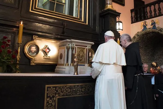Pope Francis prays before the relics of the two polish priests, Bl. Zbigniew Strzalkowski and Bl. Michal Tomaszek. ?w=200&h=150