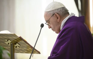 Pope Francis prays during Mass in Casa Santa Marta April 2, 2020.   Vatican Media.