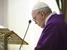 Pope Francis prays during Mass in Casa Santa Marta April 2, 2020. 