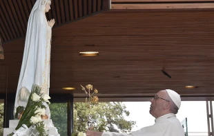 Pope Francis prays in front of the statue of Our Lady of Fatima, May 12, 2017.   Vatican Media.