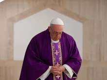 Pope Francis prays in the chapel of Casa Santa Marta March 16, 2020. 