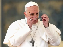 Pope Francis puts on his glasses during the general audience on March 27, 2013 in Vatican City. 