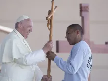 Pope Francis receives a cross made by an inmate at the CeReSo n. 3 prison in Ciudad Juarez, Mexico, Feb. 17, 2016. 