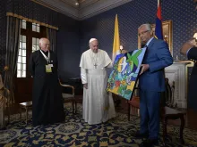 Pope Francis receives a gift from acting president of Mauritius Barlen Vyapoory Sept. 9, 2019. 