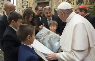 Pope Francis receives a new annotated edition of the Torah at the Vatican Feb. 23, 2017.   L'Osservatore Romano.
