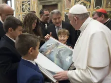 Pope Francis receives a new annotated edition of the Torah at the Vatican Feb. 23, 2017. 