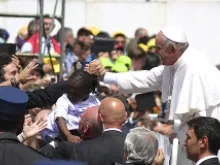 Pope Francis rides through St. Peter's Square after Mass on April 28, 2013. 