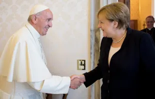 Pope Francis shakes hands with German Chancellor Angela Merkel at the Vatican June 17, 2017.   L'Osservatore Romano.