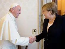 Pope Francis shakes hands with German Chancellor Angela Merkel at the Vatican June 17, 2017. 