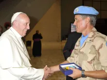 Pope Francis greets a United Nations peacekeeper from Argentina at the Vatican's Paul VI Hall, Aug. 5, 2015. 