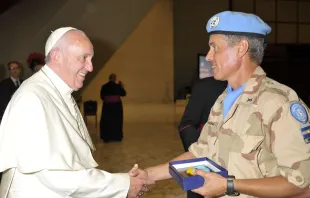 Pope Francis greets a United Nations peacekeeper from Argentina at the Vatican's Paul VI Hall, Aug. 5, 2015.   L'Osservatore Romano.