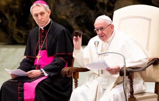 Pope Francis shows the Way of the Cross meditations he keeps in his pocket, Jan. 30, 2019.   Daniel Ibanez/CNA.