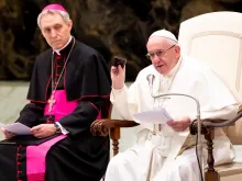 Pope Francis shows the Way of the Cross meditations he keeps in his pocket, Jan. 30, 2019. 
