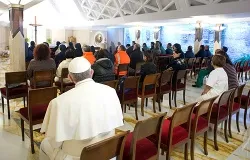 Pope Francis sits in the back of the Chapel of Domus Sanctae Marthae before celebrating Mass with the Vatican gardeners and janitors March 22, 2013. ?w=200&h=150