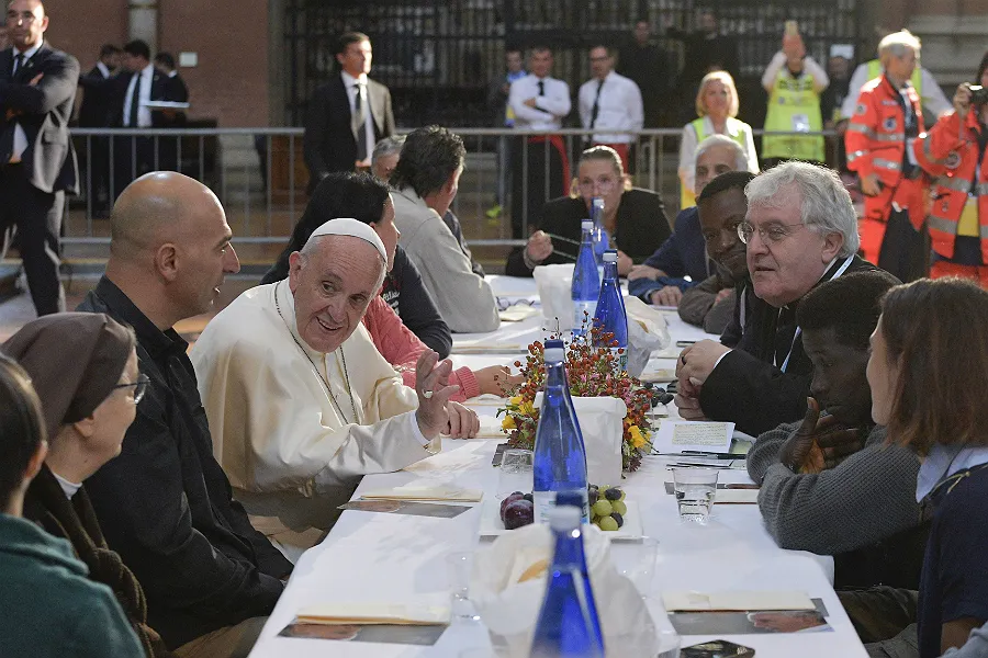 Pope Francis lunches with poor people, refugees, and the 18 prisoners who did not escape, at San Petronio Basilica in Bologna, Italy, Oct. 1, 2017. ?w=200&h=150