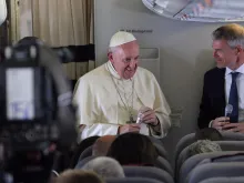 Pope Francis speaks aboard the papal plane from Madagascar to Rome Sept. 10, 2019.