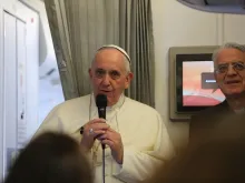 Pope Francis speaks to journalists on his flight from Sri Lanka to the Philippines on Jan. 15, 2015. 