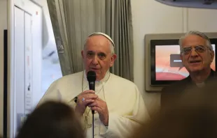 Pope Francis speaks to journalists on his flight from Sri Lanka to the Philippines on Jan. 15, 2015.   Alan Holdren.