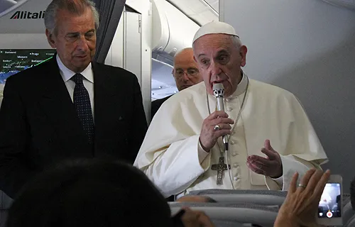 Pope Francis speaks to journalists on the papal flight en route to South Korea, August 14, 2014. ?w=200&h=150