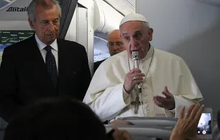 Pope Francis speaks to journalists on the papal flight en route to South Korea, August 14, 2014.  