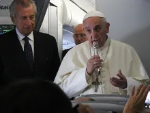 Pope Francis speaks to journalists on the papal flight en route to South Korea, August 14, 2014. 