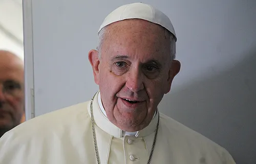 Pope Francis speaks to journalists on the papal flight to South Korea in 2014. ?w=200&h=150