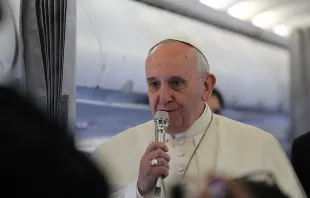 Pope Francis speaks to journalists on the papal plane on his way to Strasbourg, France, Nov. 25, 2014.   Alan Holdren/CNA.