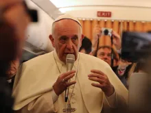 Pope Francis speaks to reporters aboard the papal flight to Armenia, June 24, 2016. 