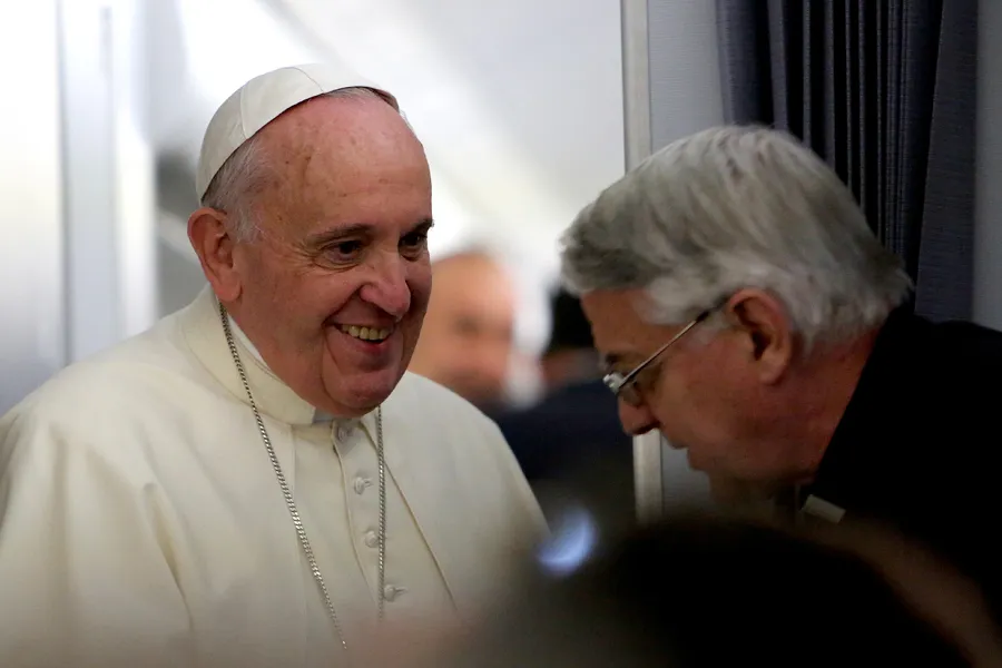 Pope Francis speaks with Holy See press officer Fr. Federico Lombardi during their flight to Sri Lanka, Jan. 12, 2015. ?w=200&h=150