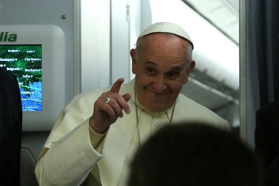 Pope Francis speaks with journalists aboard the papal plane en route to Sri Lanka, Jan. 12, 2015. ?w=200&h=150
