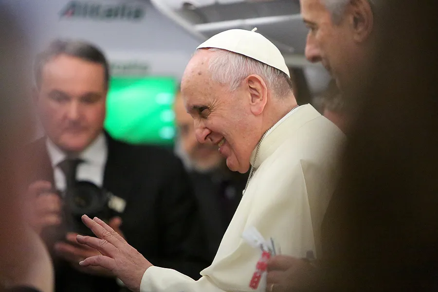 Pope Francis speaks with journalists aboard the papal plane Jan. 12, 2015. ?w=200&h=150