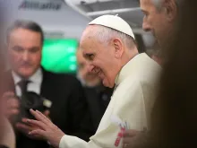 Pope Francis speaks with journalists aboard the papal plane Jan. 12, 2015. 
