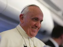 Pope Francis speaks with journalists on his flight from Sri Lanka to the Philippines on Jan. 15, 2015. 
