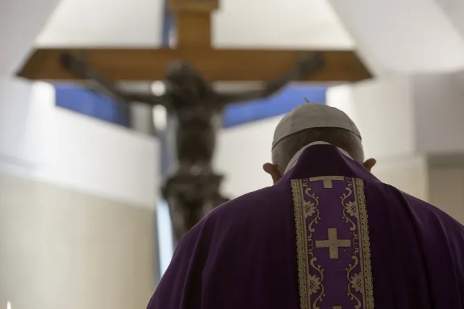 Pope Francis stands in front of the crucifix in the chapel of the Casa Santa Marta April 4 2020 Credit Vatican Media