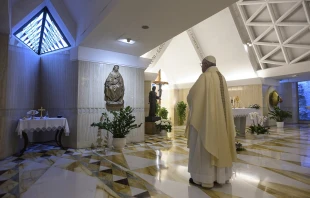 Pope Francis stops before a statue of Mary in the chapel of Casa Santa Marta May 4, 2020.   Vatican News.