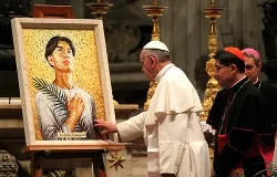 Pope Francis takes a moment to pray before the mosaic of St. Pedro Calungsod in St. Peter's Basilica Nov. 21, 2013. ?w=200&h=150